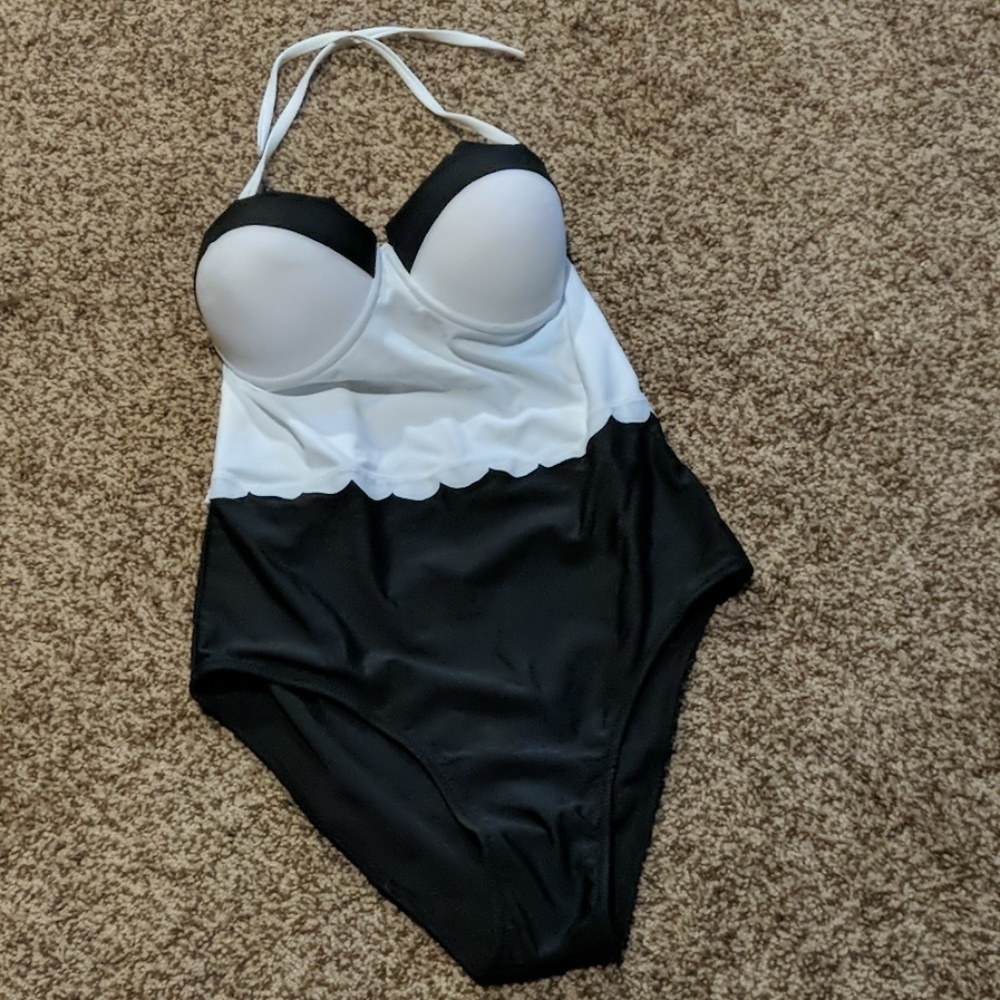 Black & white one piece, halter tie bathing suit.